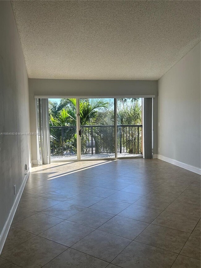 Building Photo - 8821 Wiles Rd Unit 305 Rental