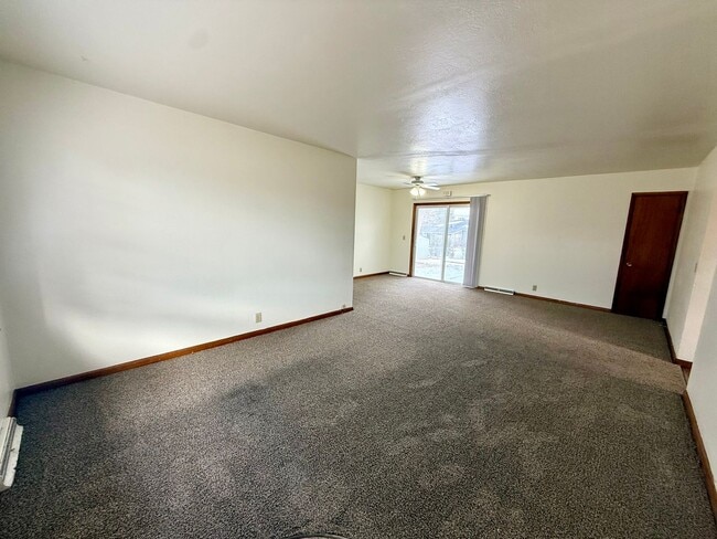 Photo - $1,000 off first months rent! Quick Move In! 3 bedroom, 1.5 Bath Home with attached garage in Lov...