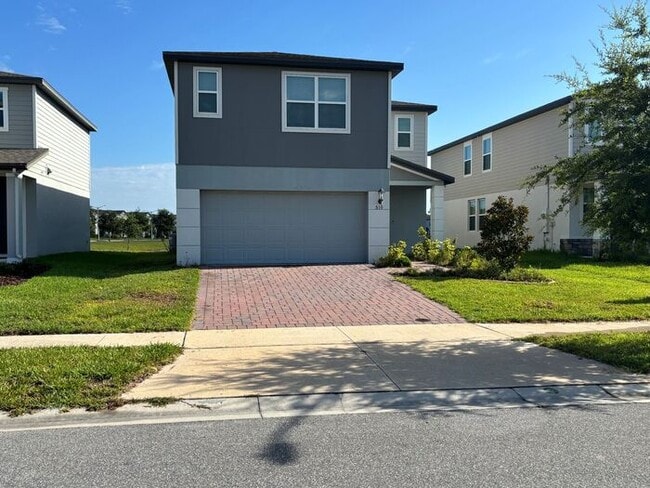Building Photo - Like-New 4 Bedroom 3 Bath with Pond View & Two Living Spaces — Minutes to South Lake Nona