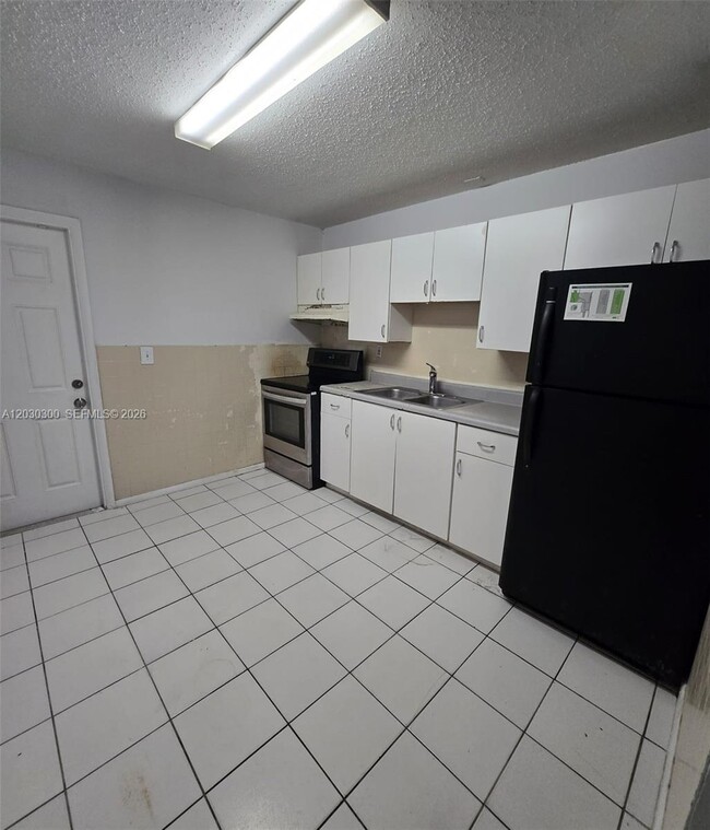 Building Photo - 5880 NW 19th Ct Unit 5888