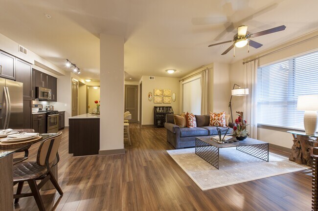 Open-concept layout uniting kitchen, dining, and living areas.