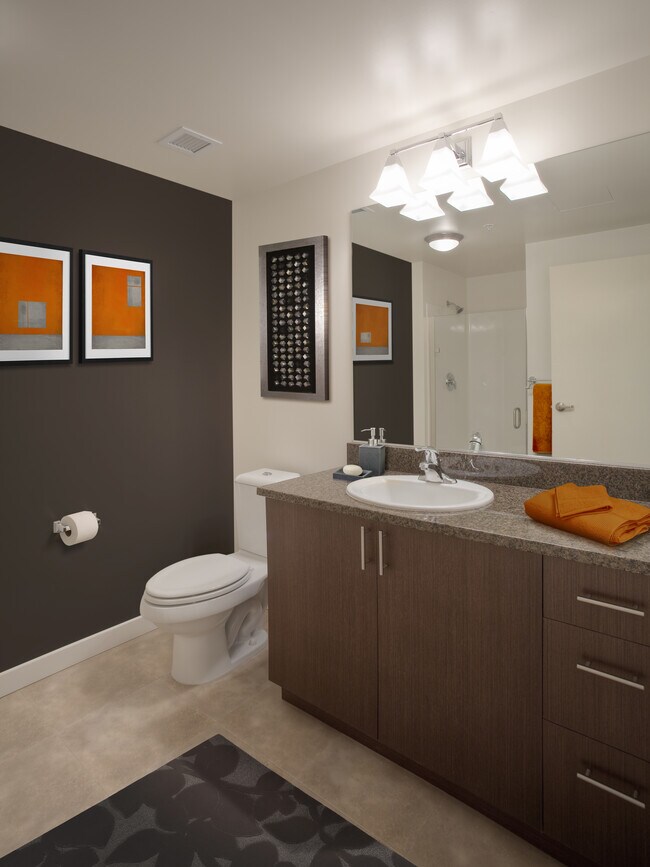 Classic Package I bath with brown speckled granite countertops, espresso cabinetry, and hard surface flooring