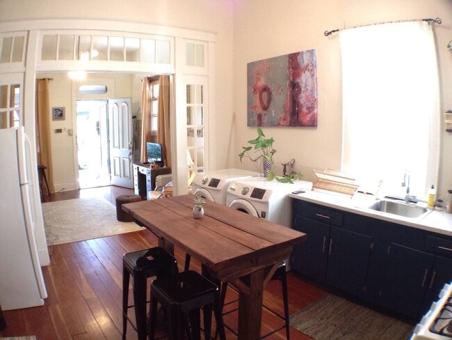 Kitchen with front load washer dryer - 2815 Ursulines Ave Unit 2815