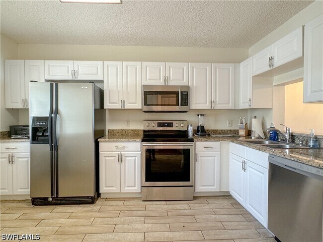 Building Photo - 7794 Emerald Cir Unit A-102
