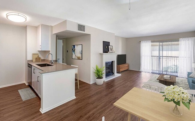 Renovated Package I kitchen, dining, and living area with hard surface flooring