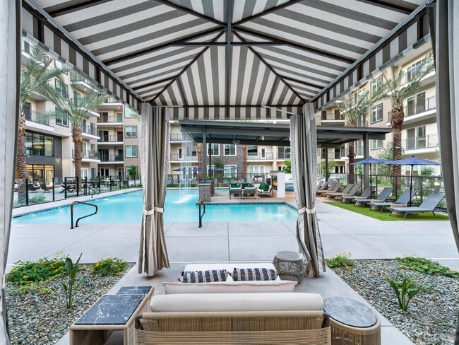 Enjoy shaded comfort and poolside views from the cabanas, perfectly positioned for a relaxing Arizona day.