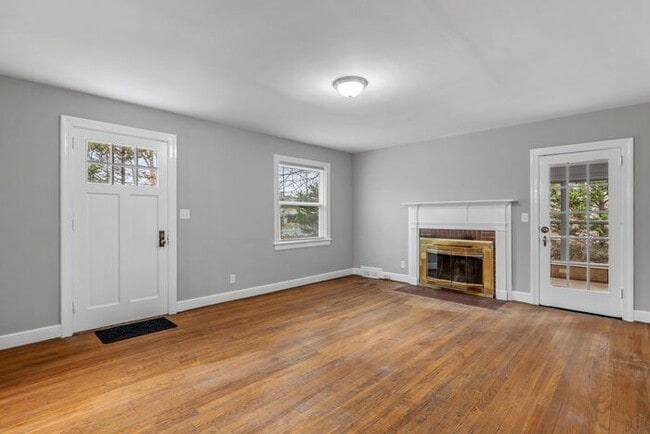 Photo - Brick home, Two Story, Hardwoods, DR, 2 Sun Rooms, FP, Carport!.