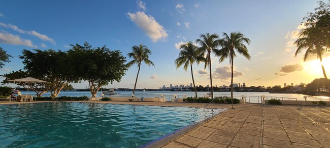 West facing view with infinity pool and deck over water. - 3 Island Ave Condo Unit 5H