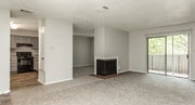 1BR, 1BA - 968SF Living Room Fireplace, Patio, Dining Room & Kitchen