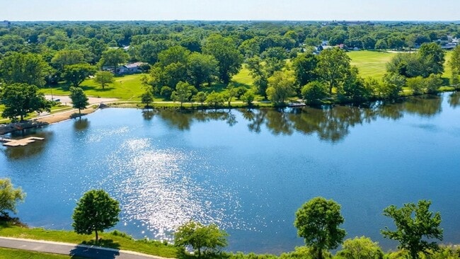 Showing part of the lake, with kayak launch, beach, and gorgeous fields in the park - Lakeview Residences