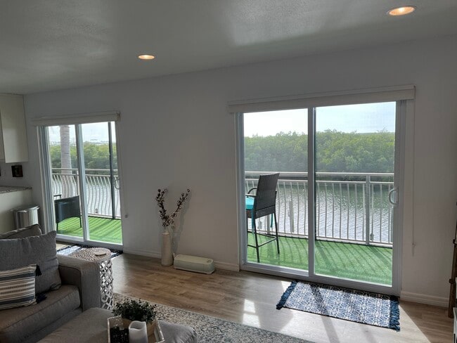 Waterfront views from living room - 8815 Bay Pointe Dr Unit C205