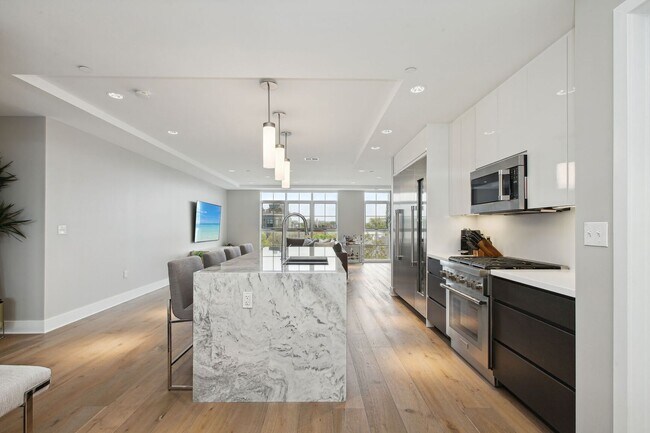 Photo - Elegant 2BR at The Adora | 1,500+ SF, Chef’s Kitchen & Garage Parking!