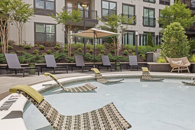Resort-style Swimming Pool with Tanning Ledge, Cabanas and Sundeck - Bexley Chamblee