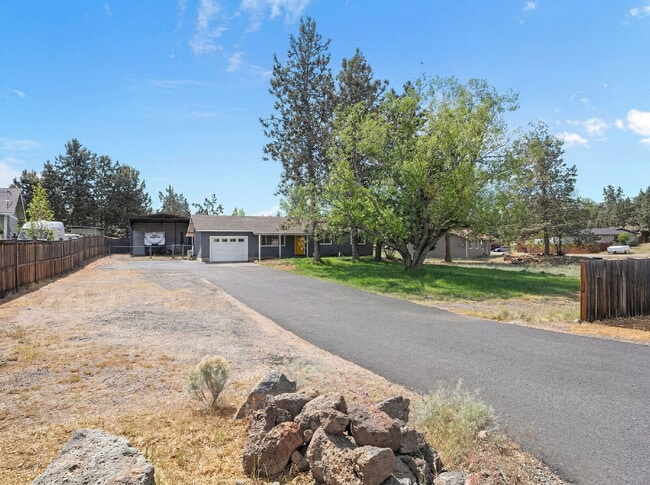 Photo - Charming 3-Bedroom Bend Home on 1/2 Acre with Expansive Yard, Mature Trees & Covered RV/Boat Storage