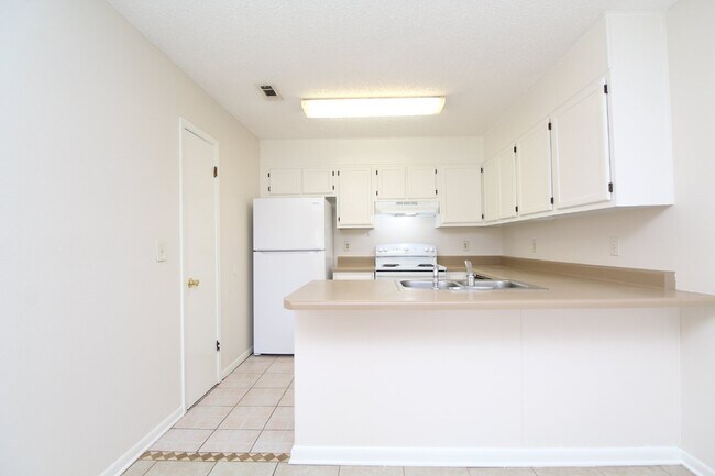 Photo - Gulf Breeze 2BR Apartment in Greenbriar with Large Bedrooms, Fenced Patio, Huge Backyard & Water/... Unit C