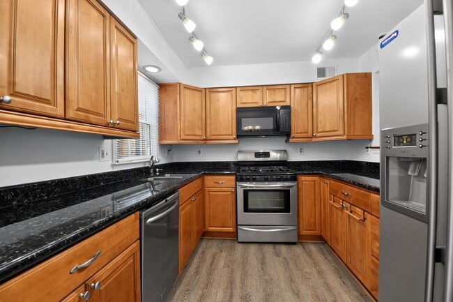 Photo - Welcome home to this light-filled, updated 4Bd/3.5Bth brick TH nestled in the sought-after Boniwo...