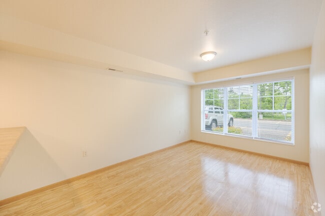 Style A 4BR, 2BA - 1, 425SF - Living Room - University Falls Apartments