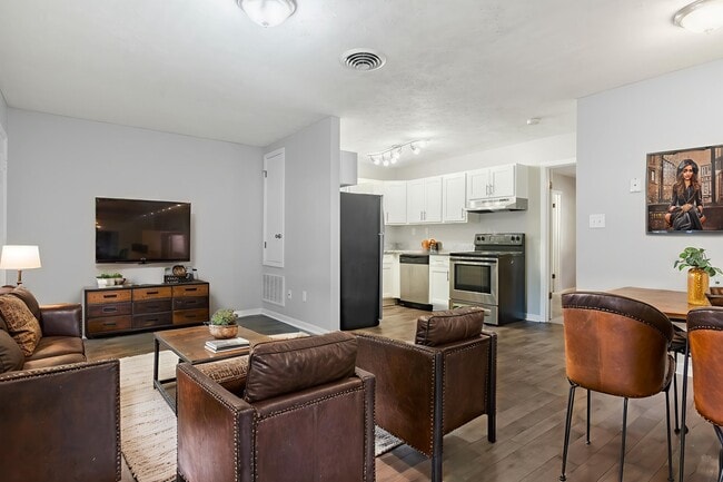 Unwind in the modern elegance of Arbor Terrace. This spacious living area features sleek furnishings, updated appliances, and warm tones that create a welcoming atmosphere. Make this your new home today! Schedule a tour now.
