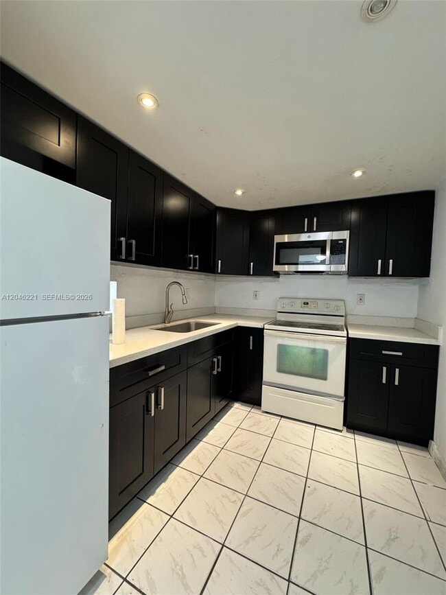 Building Photo - 5775 W 20th Ave Unit 310