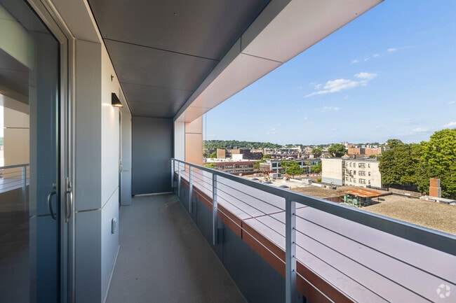 2BR, 2.5BA - 1,300SF - Living Room Balcony