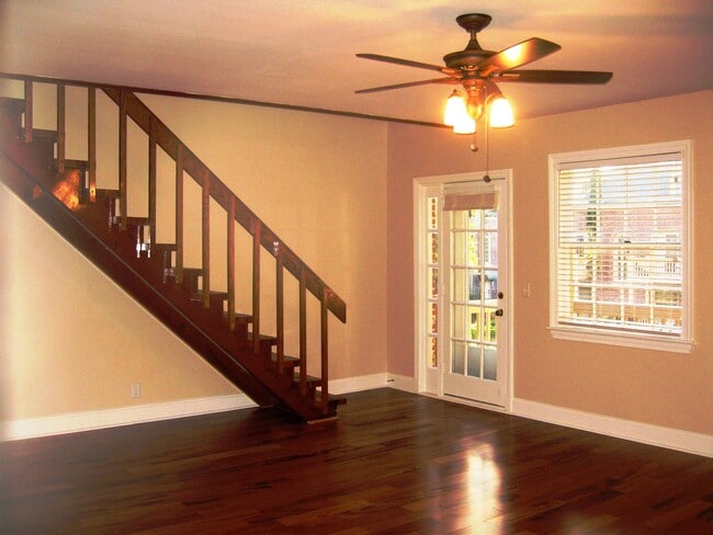 Living room with the door to the patio and stairs to the loft /master bedroom - 849 Lasalle St Unit 849