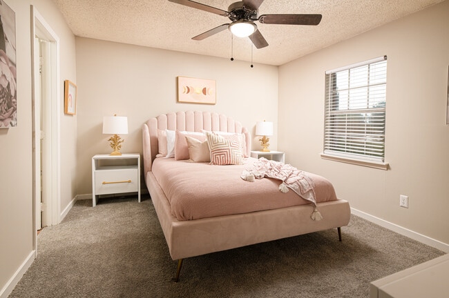 Stay comfortable year-round in this stylish bedroom with a ceiling fan at Southwind Apartments in Richland, MS!