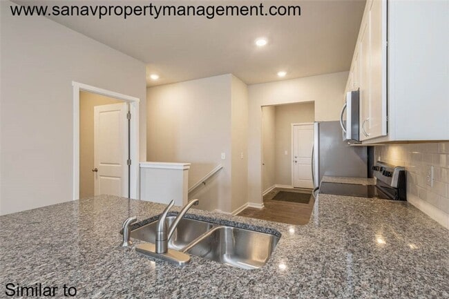 Photo - Modern Charm: 2-Bedroom, 2-Bathroom Home with Open Floor Plan and Rear Load Garage