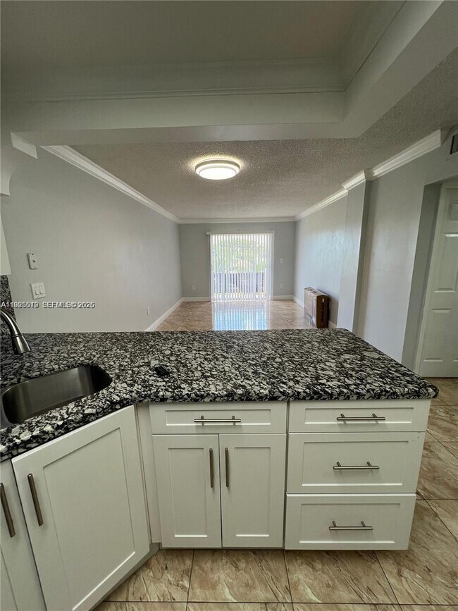 Photo - 1075 W 68th St Unit 218