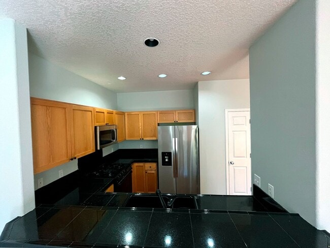 Photo - Elegant Arbor Townhome with Open Kitchen, W/D, Patio, and Soaking Tub