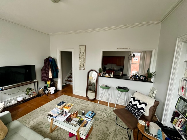 Livingroom with view of kitchen via breakfast bar - 3702 Spring Garden St Unit #3