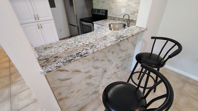 View from DR into kitchen - 1353 Pine Ridge Cir E Unit 128 E3