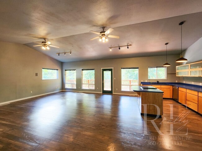 Photo - Vaulted Ceilings, Unique Designer Kitchen & Expansive Half-Acre Setting with Flexible Living Spaces