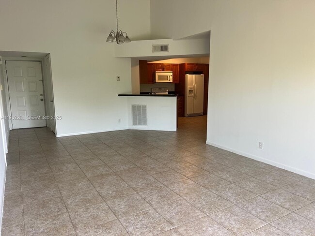 Building Photo - 8821 Wiles Rd Unit 306