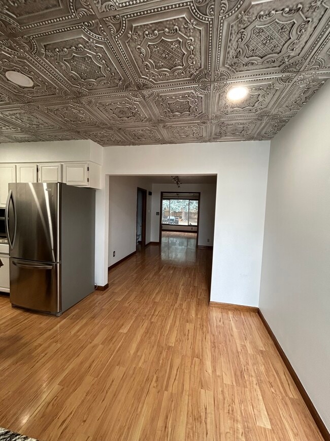 Kitchen has extra area and leads into dining room - 435 E Drake Rd
