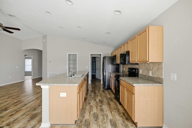 Photo - 4BR Gated Community Home with Fenced Yard, 2-Car Garage & Open Floor Plan