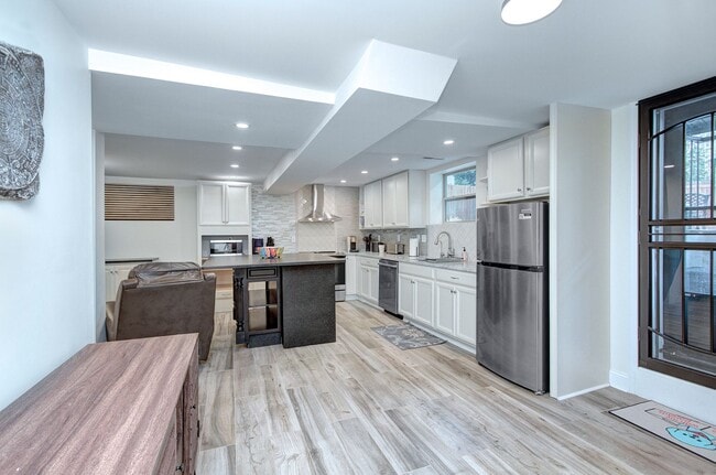 Photo - Discover the charm of this FULLY FURNISHED basement unit, tucked away in a beautifully updated bu...