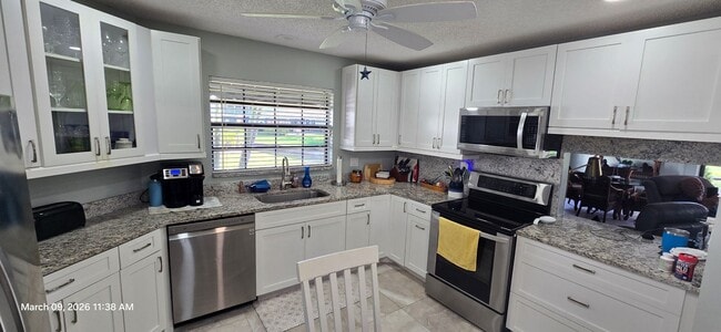 Photo - Welcome to **Caloosa Yacht & Racquet Club**, one of Fort Myers’ most charming **gated waterfront ...