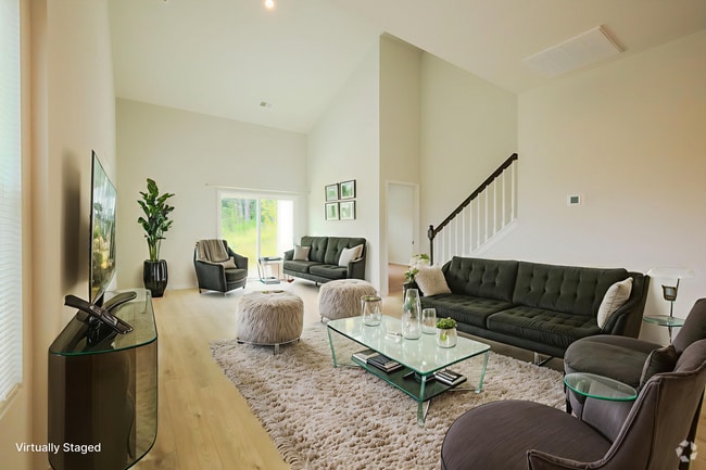 Living area with vaulted ceiling.Photo virtually staged. - 1542 Alvin Pond Dr Rental