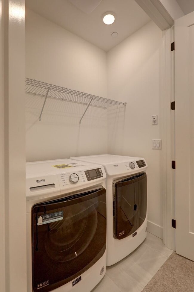 Photo - Live Where Style Meets Convenience – 2BR Townhome + Garage