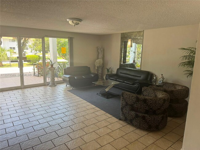 Building Photo - 4880 NW 22nd St Unit 110
