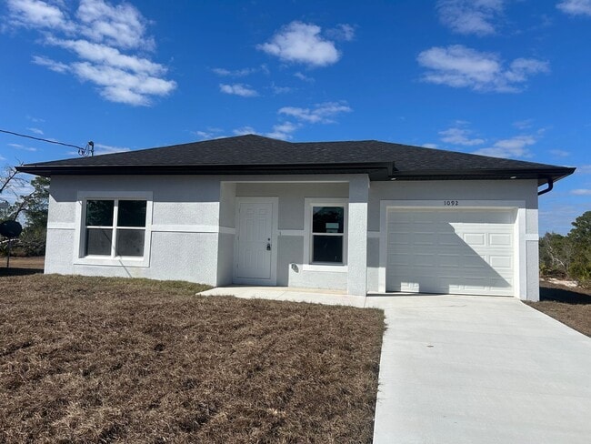 Building Photo - Brand-New Modern 2BR/2BA Home with Garage- In Serene Lake Placid Location