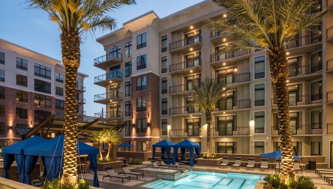 Exterior and Pool at Dusk - Skyline at Midtown Apartments