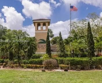 Building Photo - 9491 Palm Cir S Unit 203