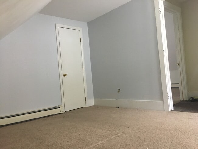 Upstairs bedroom #1. The bedrooms are modest, but as you can see they get good light. - 12 Boynton Street Unit Apt 3