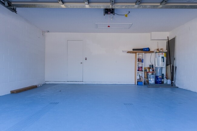 Photo - Spacious 4-Bed Groveland Home with Attached Garage, Central Air, and Private Patio