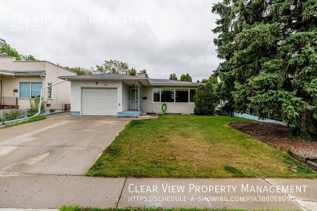 Building Photo - ?? Charming 2-Bedroom Upper Level Suite with Garage and Utilities Included!!