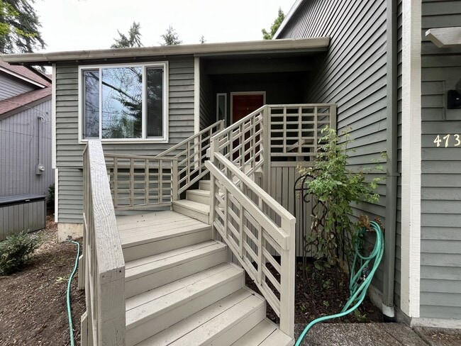 Photo - Spacious 3-Bedroom Home with Custom Stone Fireplace, Attached 2-Car Garage & Expansive Backyard i...