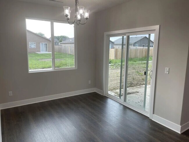 Photo - Single family slab home with three car garage. This home is 4 bedrooms, three bathrooms open floo...