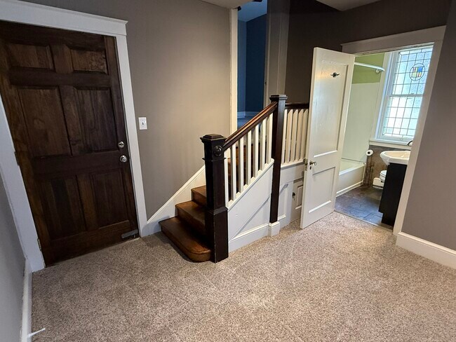 Entry area, bathroom, steps to bedrooms - 218 E Orange St Unit Apt. 2