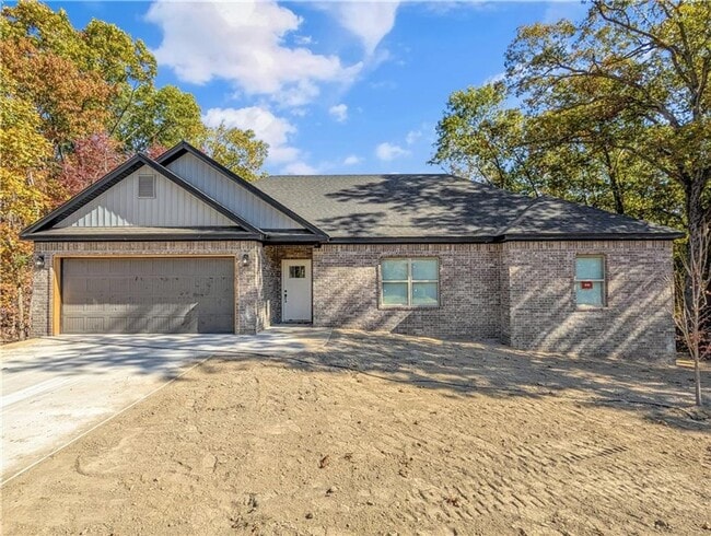 Building Photo - Modern open-concept living meets peaceful nature views in this custom-crafted retreat.